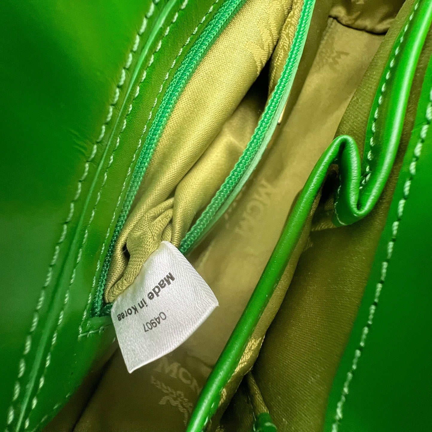 MCM Munich Mini Bag Handbag Handtasche Designer Bags MCM coat outerwear pufferseason second hand vintage shop österreich germany deutschland angebot daunenjacke winterjacke jacke